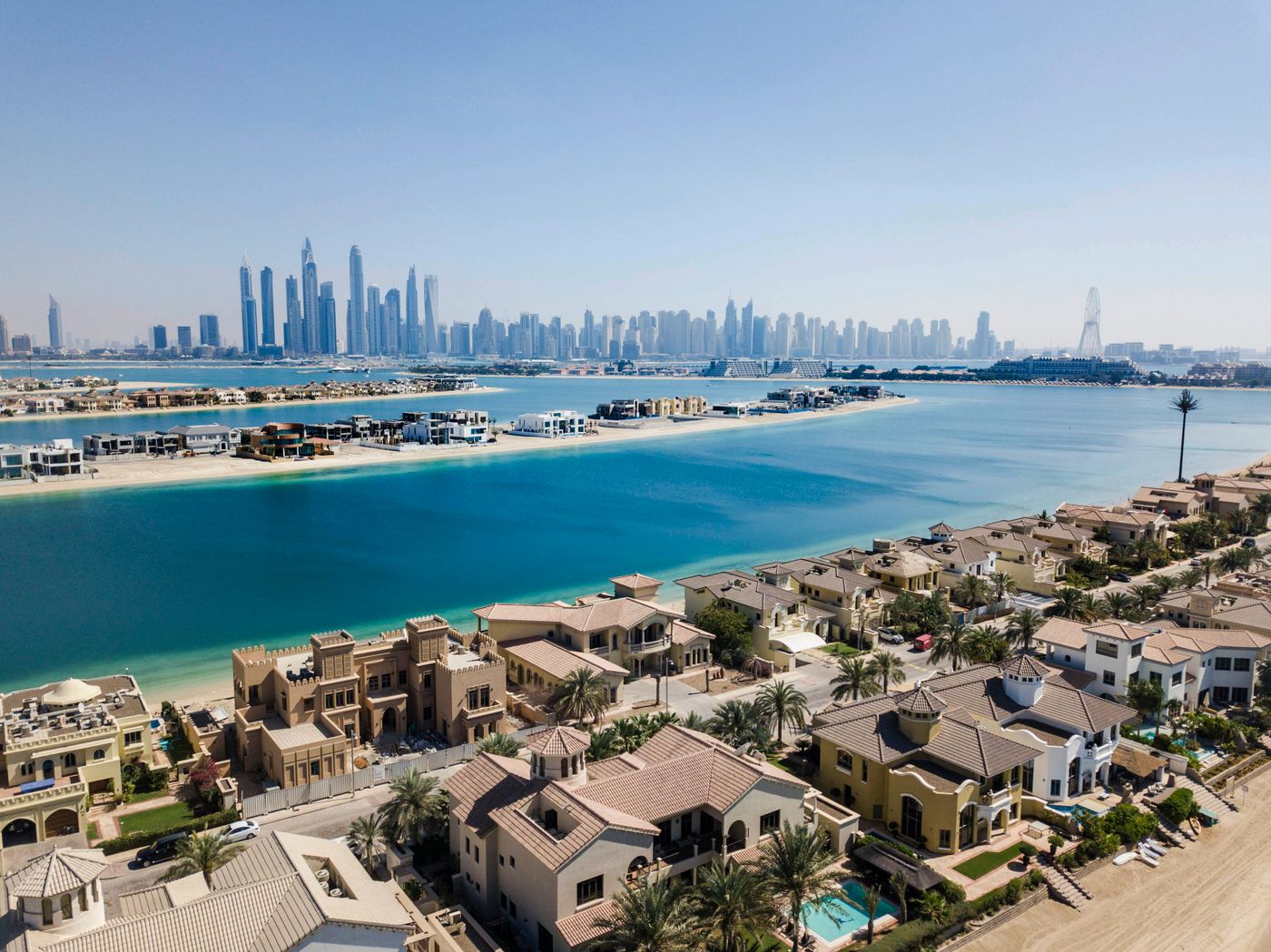 Villas in a Dubai community with the skyline behind